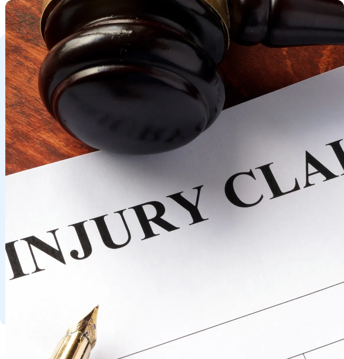 Here's an alt tag for the image: `Injury claim form and gavel`